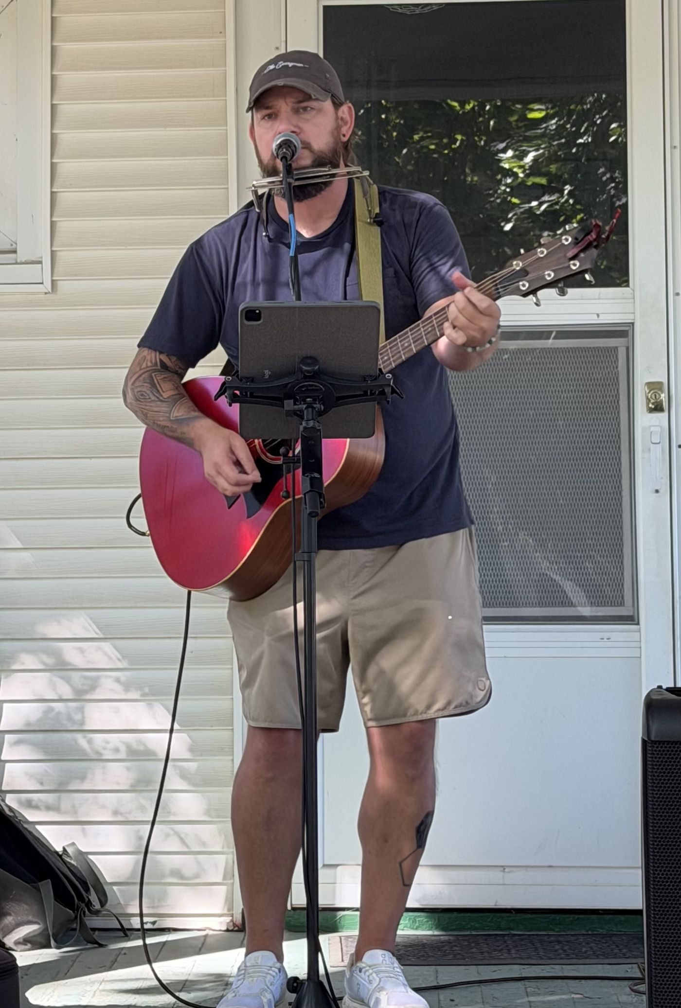Colin Roberts playing an outdoor porch show